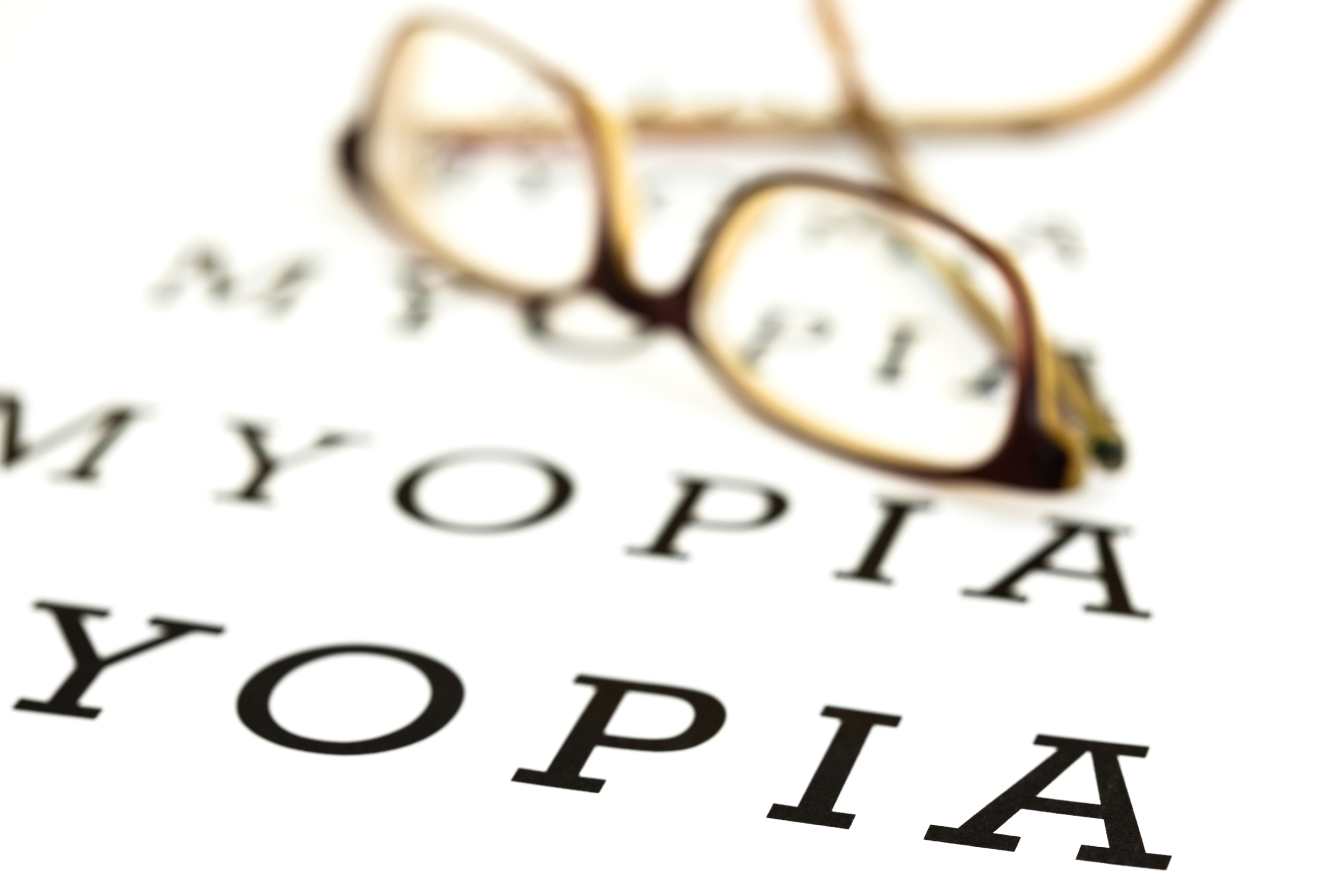myopia written in eye chart style with a pair of glasses