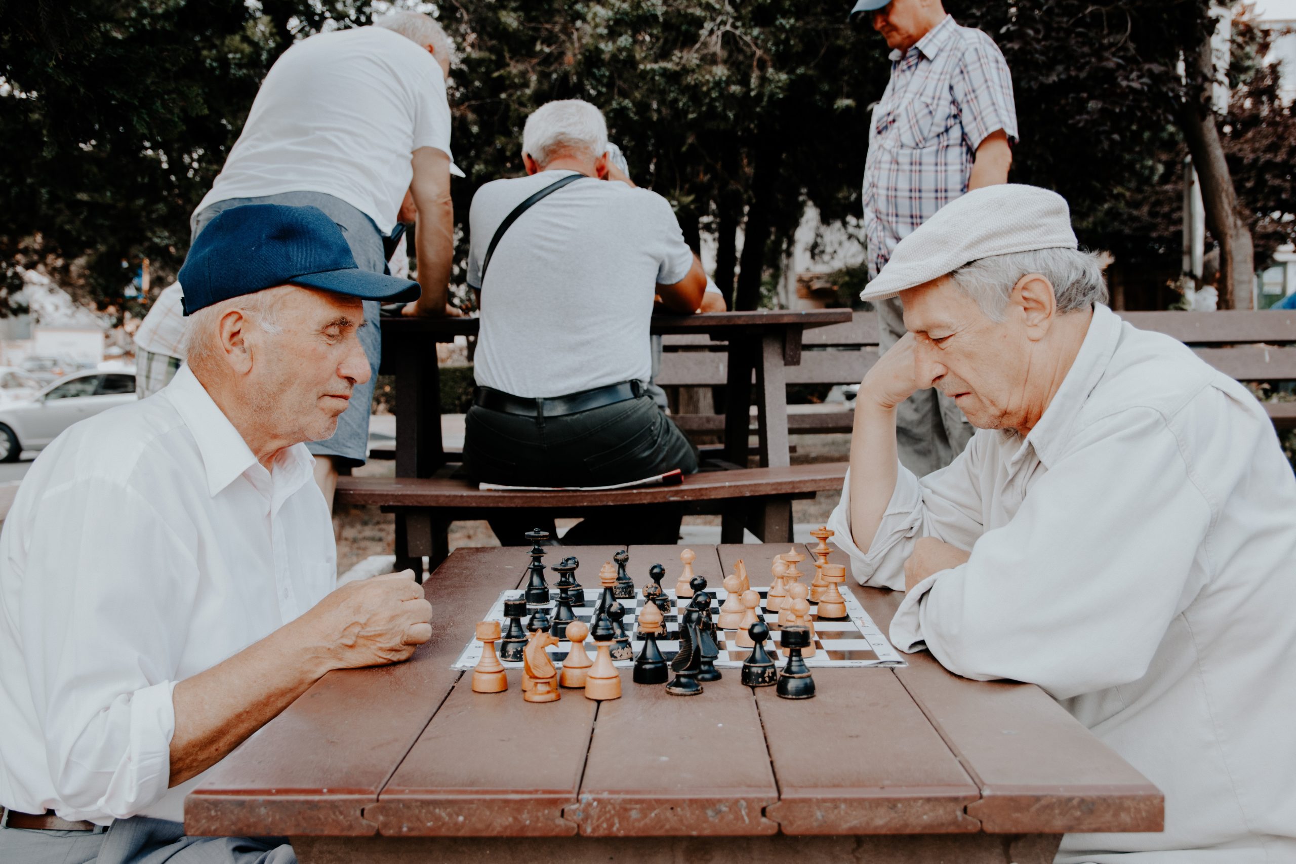 Old men playing chess outside